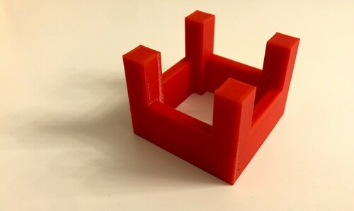 The printed castle: four tall oblongs, joined by four shorter ones.